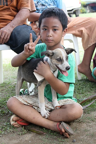 Samoan boy with puppy
